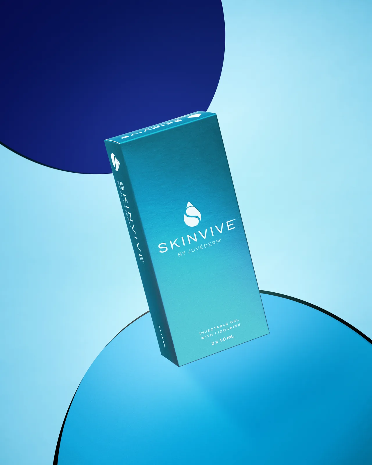 Skinvive by Juvederm carton floating between two blue discs