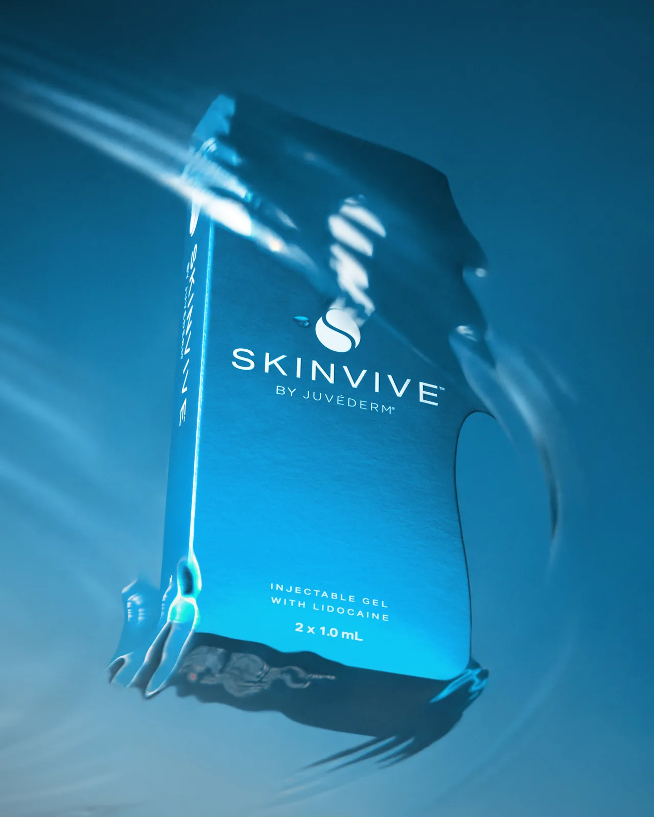 Caja de Skinvive fotografiada a través de agua en movimiento, la ruta de hidratación de la lista glass skin