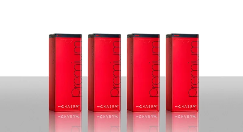 Four The Chaeum Premium filler cartons standing in a row on a reflective surface
