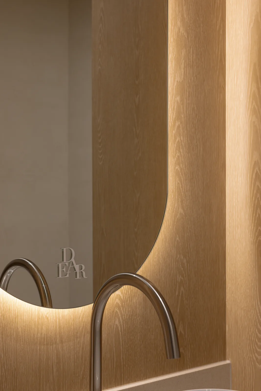 Oak-panelled waiting bench with a side table at Dear Clinic Cheongdam